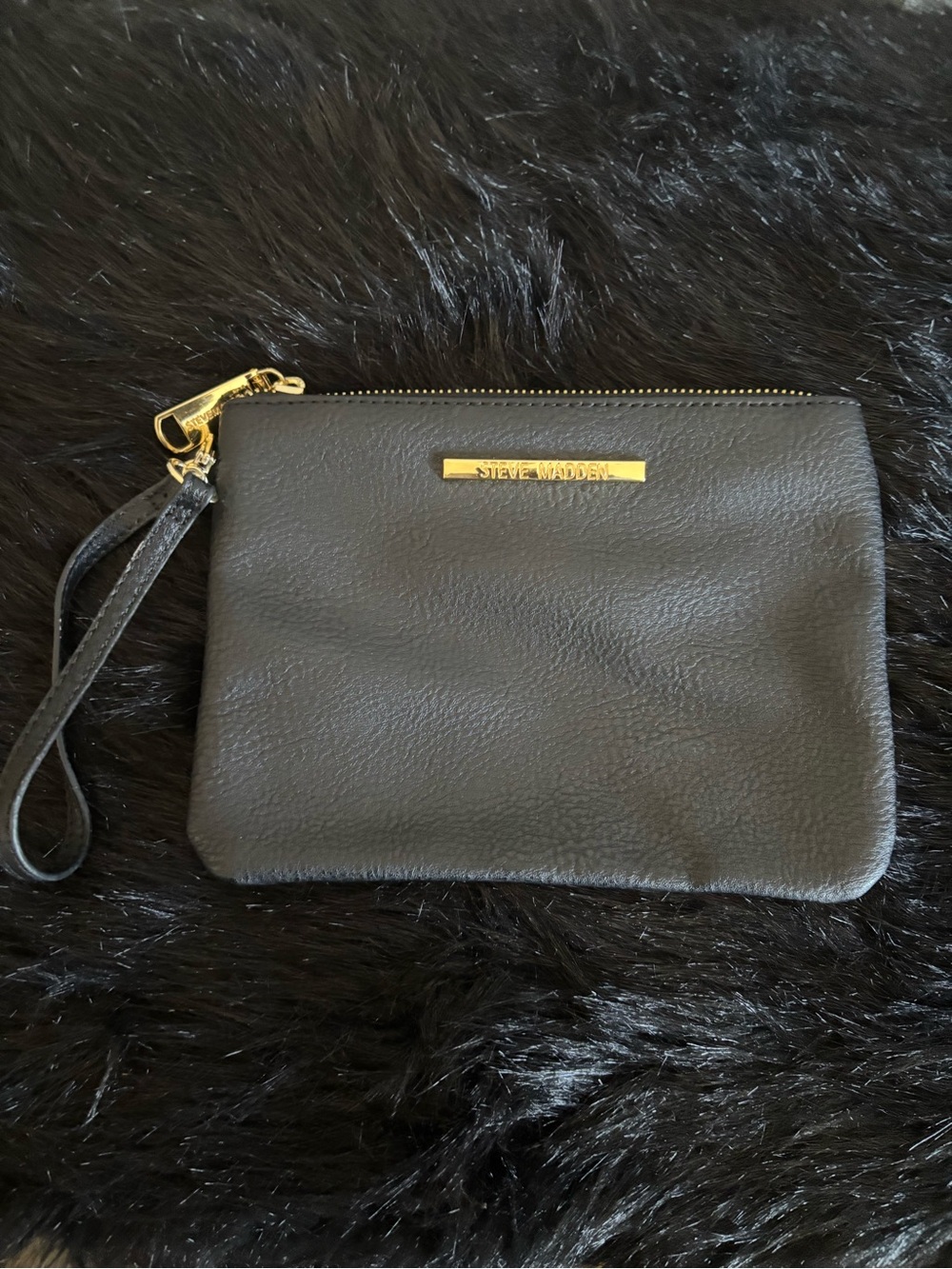 Excellent condition Steve Madden Black Leather Wristlet Pouch, has small flaw